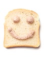 PÃÂ¢tÃÂ© spread smiley on slice of bread Royalty Free Stock Photo