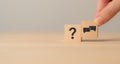 Q and A concept. Q and A symbols on wooden cube blocks on a grey background.