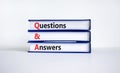 Q and A, questions and answers symbol. Concept words `Q and A questions and answers` on books on a beautiful white table, white Royalty Free Stock Photo