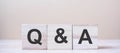 Q&A word with wooden cube block. FAQ frequency asked questions, Answer, Question & Ask, Information, Communication and