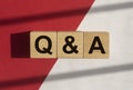 QA text on white and red background. QnA acronym. Q concept. Questions and answers Royalty Free Stock Photo