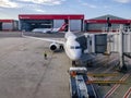 Qantas airplane docked onto a jetway at Sydney Domestic Airport
