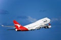 Qantas Boeing 747 jet in flight on a blue sky
