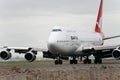 Qantas Boeing 747 jet taxis on the runway.