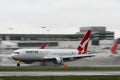 Qantas Boeing 767 with background motion blur.