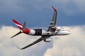 Qantas Boeing 737 aircraft VH-XZJ named Mendoowoorrji wearing a special aboriginal themed livery performing a flypast over Melbour