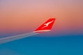 Qantas plane wing at sunrise