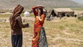 Qashqai Turkish man and woman talking in their land, Shiraz, Iran