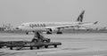 Qatar airplane on the runway at Tan Son Nhat Airport