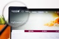 Qatar Airways Logo under a magnifying glass. Qatar Airways Website on Laptop screen Royalty Free Stock Photo