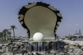 Qatar, Doha, Pearl Oyster Monument with its fountain at the northern end of the Corniche. Royalty Free Stock Photo