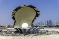 Qatar, Doha, Pearl Oyster Monument with its fountain at the northern end of the Corniche. Royalty Free Stock Photo