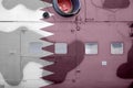 Qatar flag depicted on side part of military armored helicopter closeup. Army forces aircraft conceptual background Royalty Free Stock Photo