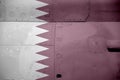 Qatar flag depicted on side part of military armored helicopter closeup. Army forces aircraft conceptual background Royalty Free Stock Photo