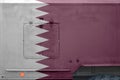 Qatar flag depicted on side part of military armored truck closeup. Army forces conceptual background Royalty Free Stock Photo