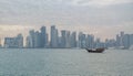 Qatar skyline along qatar traditional dhow in the foreground