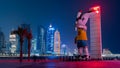 Qatar skyline with Orry The Oryx in the foreground