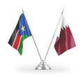 Qatar and South Sudan table flags isolated on white 3D rendering