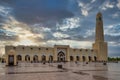 Qatar State Mosque Imam Muhammad ibn Abd al-Wahhab Mosque exterior view at sunset with clouds in the sky Royalty Free Stock Photo