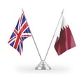 Qatar and United Kingdom table flags isolated on white 3D rendering