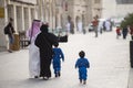 The Qatari family in traditional attire.