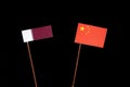 Qatari flag with Chinese flag on black