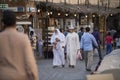Qatari locals in traditional attire.