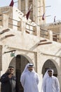 Qatari locals in traditional attire.