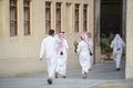 Qatari locals in traditional attire.