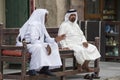 Qatari locals in traditional attire.