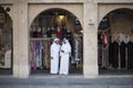 Qatari locals in traditional attire.