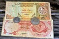 Qatari Money, money background of old coins and banknotes of riyals of different eras, old vintage retro Qatar money coin and