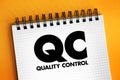 QC Quality Control - process by which entities review the quality of all factors involved in production, acronym text concept on