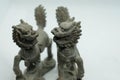 Close-up of Chinese bronze Qilin figurines, mythical creatures with dragon head, deer antlers, fish scales, ox hooves & lion tail