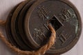 Qing dinasty coins through a string macro shot