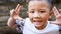 Qingyuan, China - June 23, 2016: Happy young little Asian boy outdoors