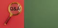 Qna inscription on red and green banner through magnifying glass. QA acronym. Q concept. Questions and answers