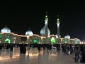 QOM, IRAN - 2018: A large crowd of people walk in the yard of Jamkaran mosque at night. Qom, Iran