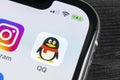 QQ messenger application icon on Apple iPhone X smartphone screen close-up. QQ messenger app icon. Social media network