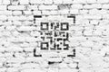 QR code concept. Encoded web link on a brick wall.