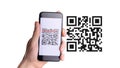 Qr code mobile. Hand holding digital mobile smart phone with qr code scanner on smartphone screen for pay, scan barcode