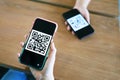 Qr code payment. Woman scanning QR code online shopping cashless technology concept