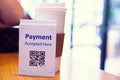 QR code payment tag with blur coffee in coffee shop or restaurant to accepted generate digital pay without money