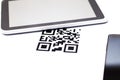 Qr code and tablet computer on the table at home Royalty Free Stock Photo