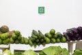 Qr codes for cashless payment stands over a street vegetable booth