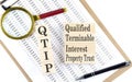 QTIP Qualified Terminable Interest Property text on wooden block on chart background Royalty Free Stock Photo