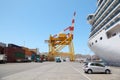 Quaboos port: big cruise ship in port, cargos