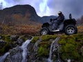 Quad bike in the mountains in the autumn day