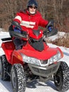 Quad bike rider on snow