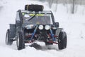 The quad bike's drivers ride over snow track